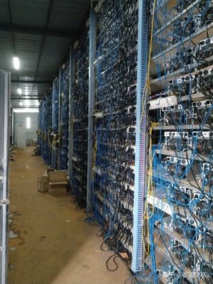 Rows of mining rigs humming inside a vast, temperature-controlled mining farm.